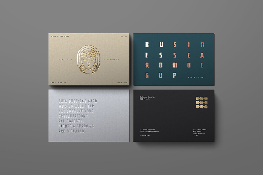 Four business cards in flat-lay on a neutral grey background, showing gold, copper and blind-emboss foil finishes.