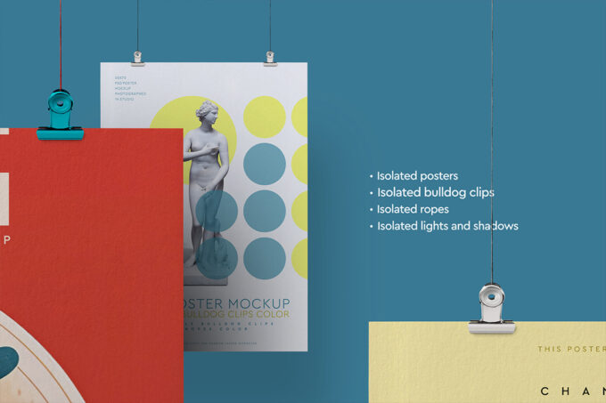 Close-up view of two hanging posters (50 x 70 cm), one red and one white, showing an isolated bulldog clip and highlighting isolated posters, clips, ropes, lights, and shadows.