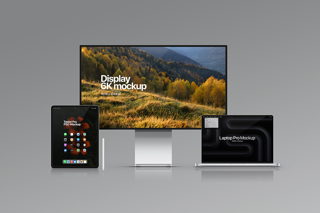 A professional studio scene showing a MacBook Pro, an Apple Pro Display XDR, an iPad Pro, and an Apple Pencil on a grey background.