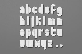 Bricks toy letters PSD featuring white lowercase alphabet a to z made of separated Lego-style brick pieces on gray background with realistic plastic reflections