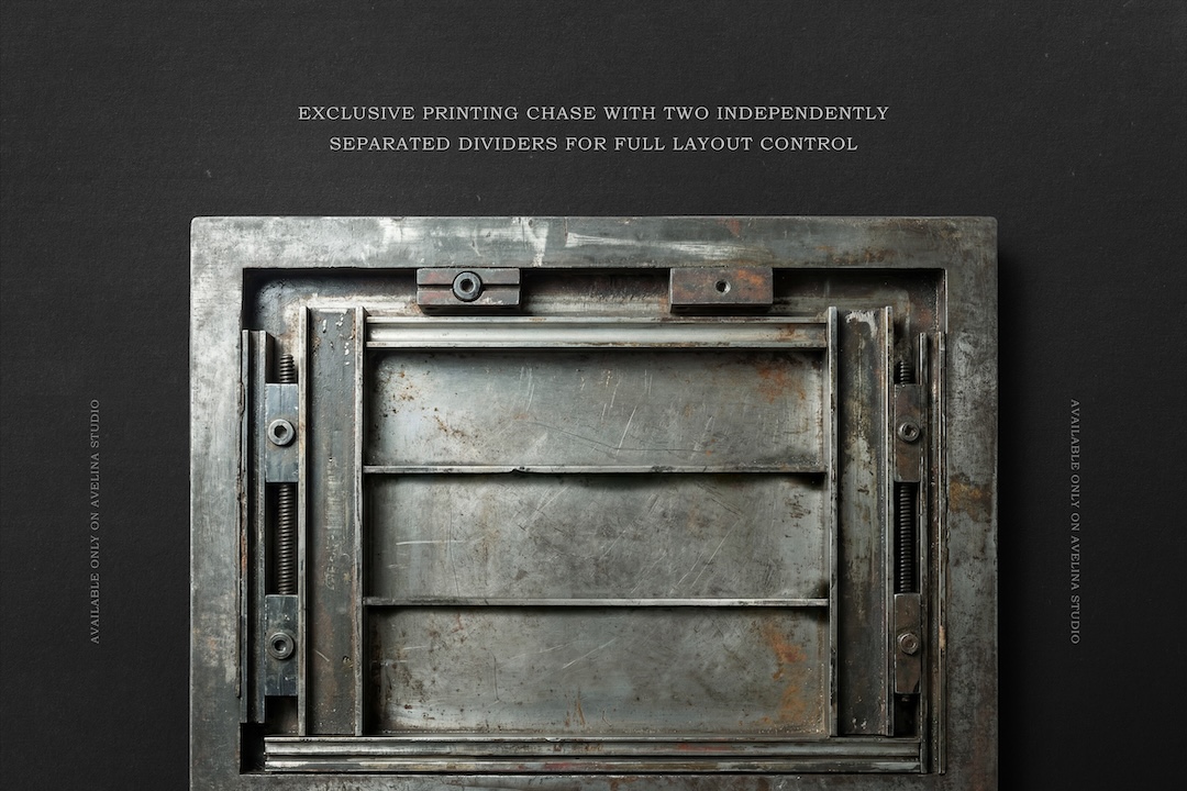Metal printing chase with separated internal dividers and empty layout area for custom letterpress compositions.