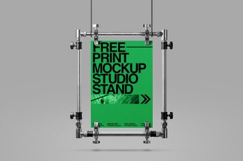 Free print mockup with suspended poster display and industrial studio stand for branding and editorial projects.