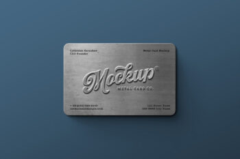 Free metal business card mockup showing an embossed brushed steel card with logo and contact details on a blue background