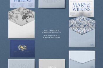 Wedding invitation envelope mockup close-up of open envelopes with botanical and blue toile bird liners beside printed invitation cards.