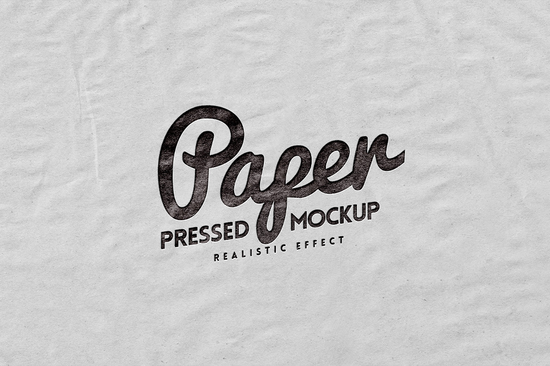 Crumpled paper logo mockup with a black script wordmark pressed into creased off white paper
