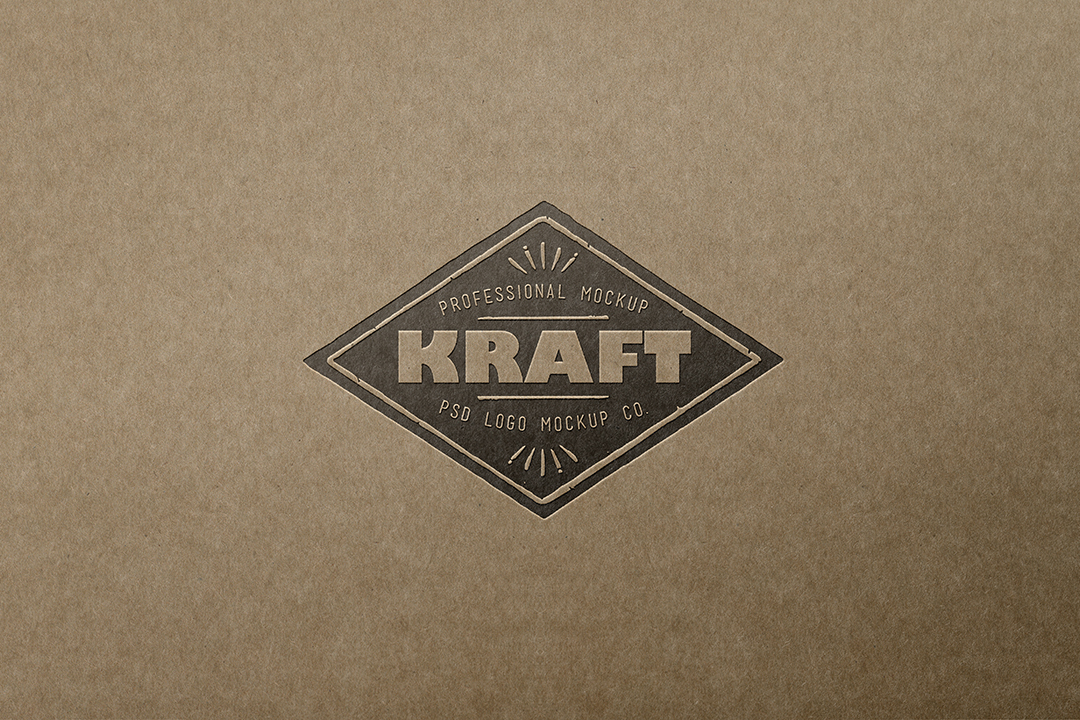 Kraft paper logo mockup with a dark diamond badge letterpressed into brown kraft card, centered flat view