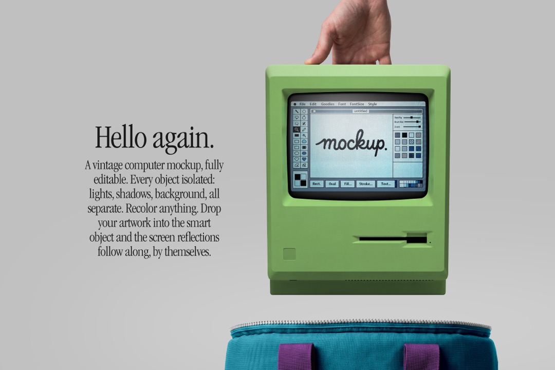 Retro computer mockup in hand recolored green with a teal carry bag, purple straps and retro paint screen
