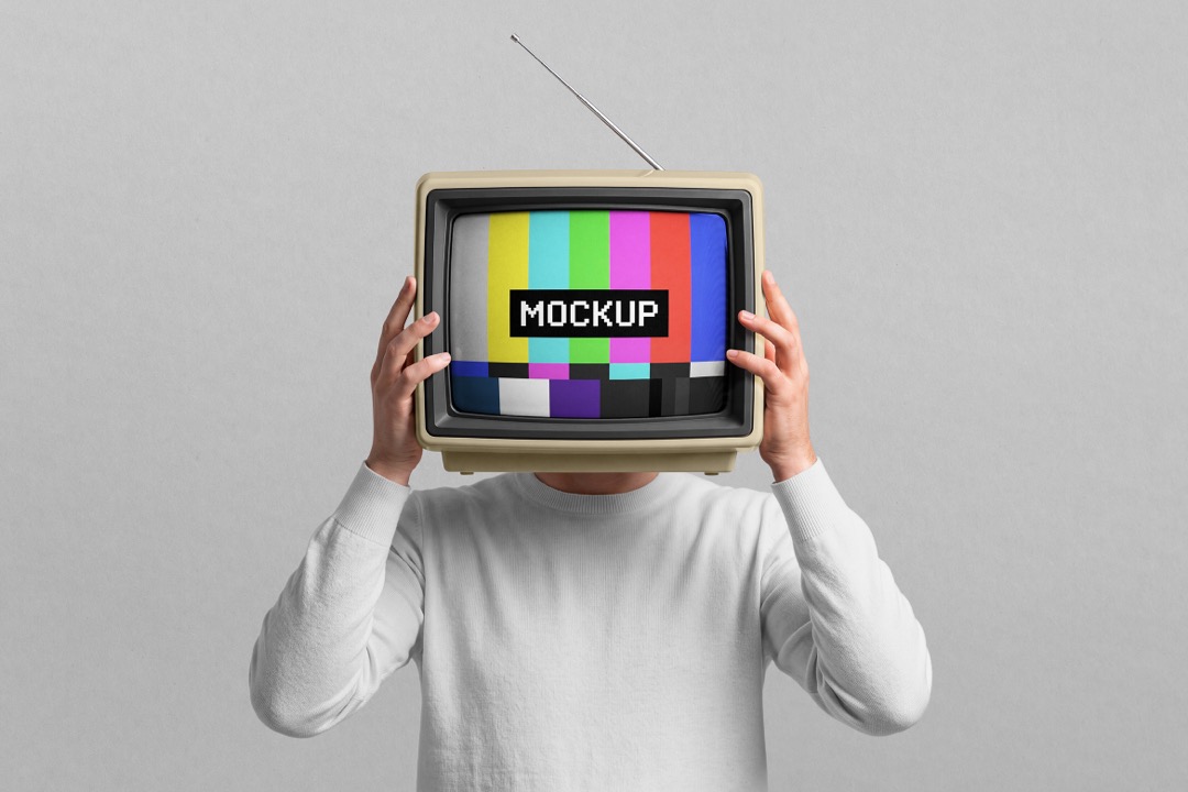 Retro TV head mockup showing a man in a white sweater holding a beige vintage television with color bars screen