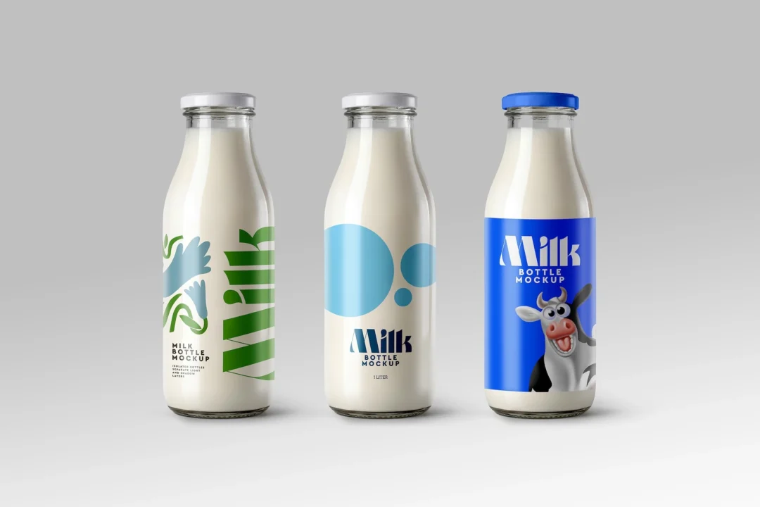 Milk bottle mockup with three glass bottles in a row, white and blue metal caps on light gray background